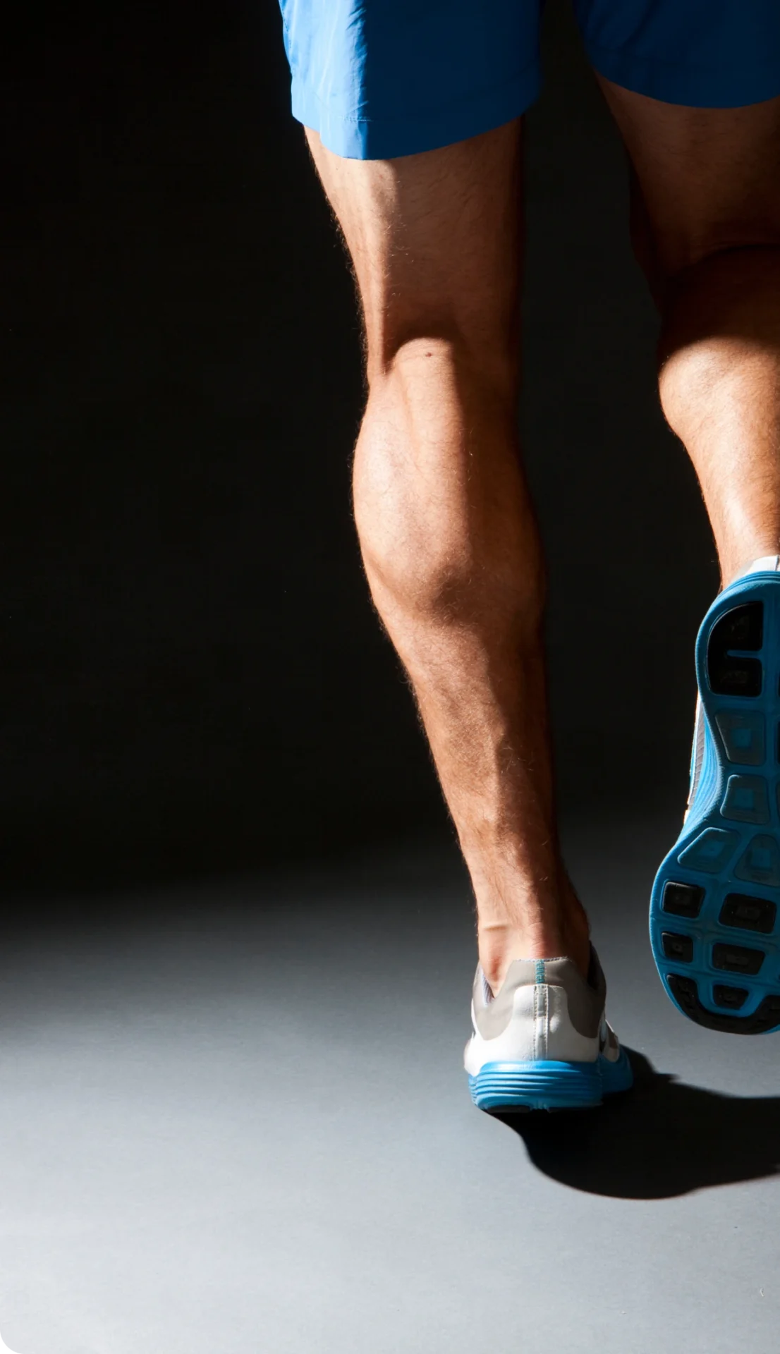Close-up of running shoes and legs